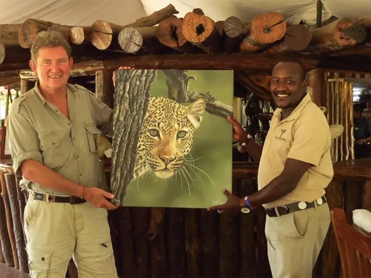 Handing over another canvas to the manager of the Governors Camp in the Masai Mara in Kenya