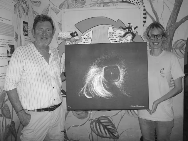 Kelly Martin the conservation manager is seen here receiving one of the canvases from Simon.